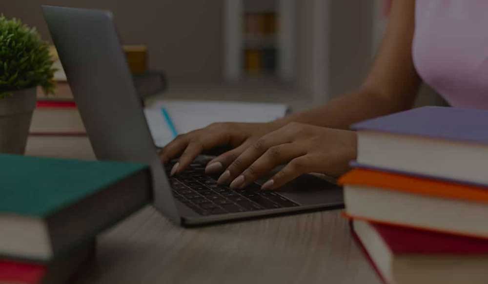 hands-of-black-female-student-typing-on-laptop